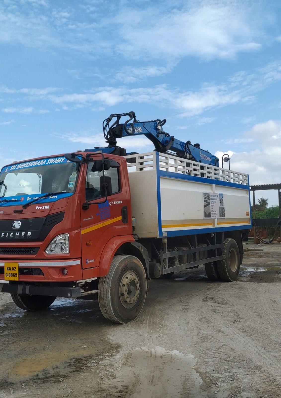 Knuckle boom crane folded on the back of a truck, front view