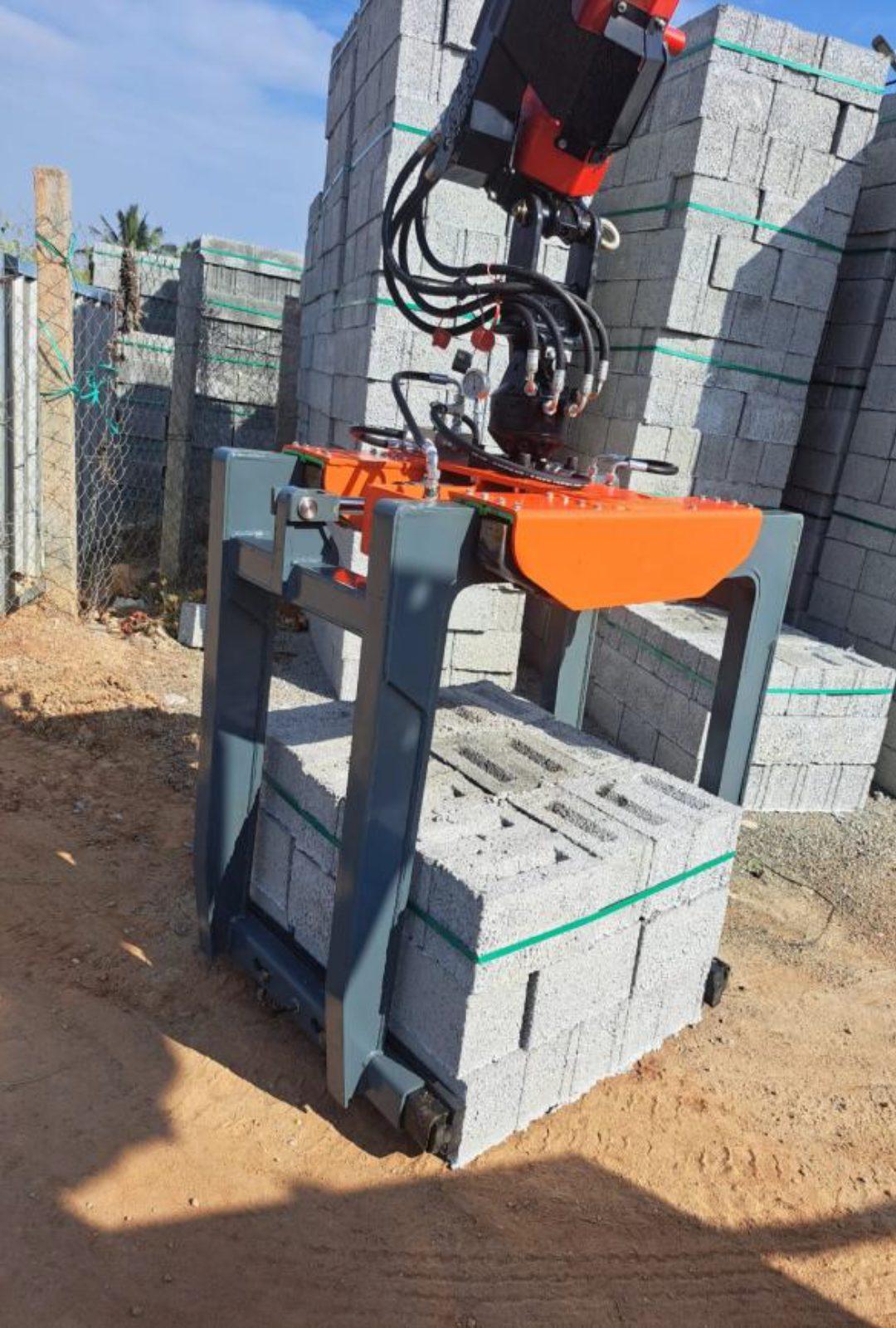 SAE 02 high-lift brick grabber on a forklift at a block yard